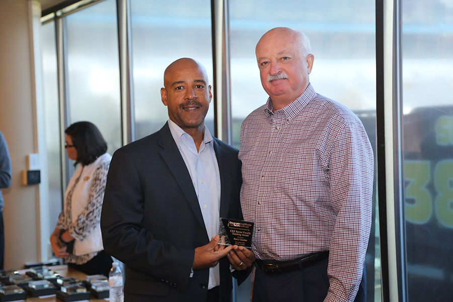 Barry Goodno receives his award from School Chair Reginald DesRoches. (Photo: Jess Hunt-Ralston)