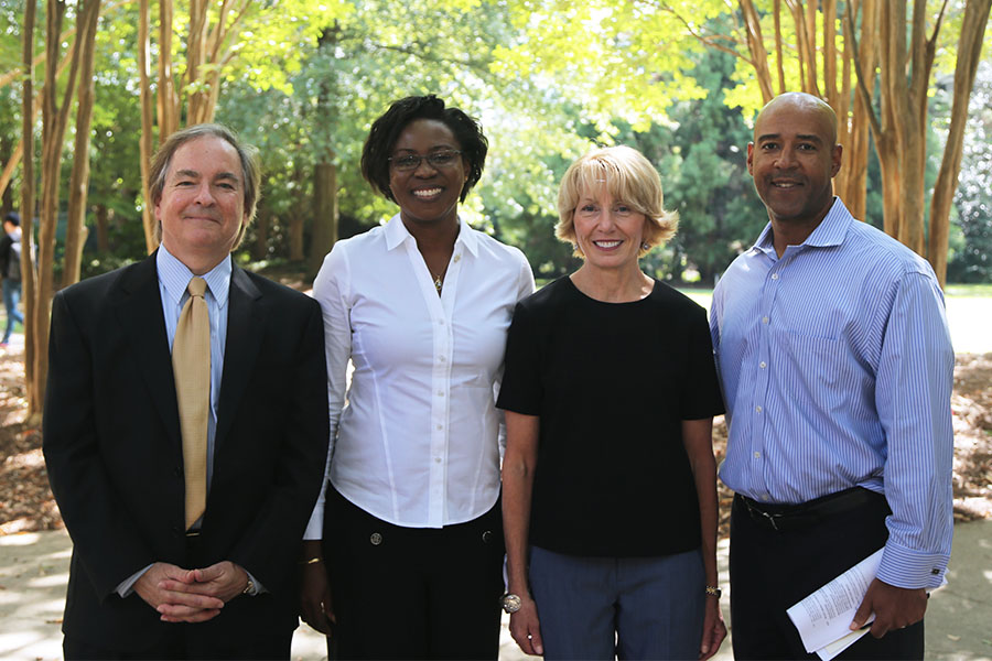 From left to right: Jim Hamilton, BCE 1977; Adjo Amekudzi-Kennedy, associate chair for global leadership and research development; Emmy Montanye, BCE 1982; and Karen and John Huff School Chair Reginald DesRoches. Hamilton, a fellow Tech grad and colleague at Kimley-Horn and Associates, introduced Emmy Montanye at her Hyatt Distinguished Lecture Sept. 20. (Photo: Jess Hunt-Ralston)