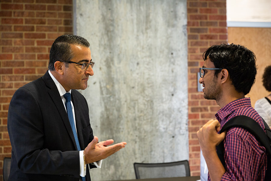 Wassim Selman talks with a student after the fall 2018 Hyatt lecture, which featured lessons Selman still carries with from his days as a civil engineering undergraduate at Georgia Tech in the 1980s. (Photo: Qiusen Huang)