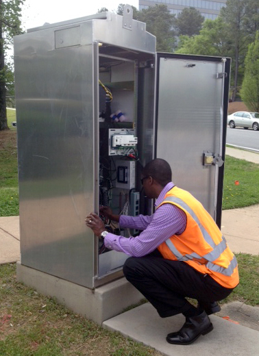 Alvin James works on a traffic signal cabinet. James, who is a traffic operations and intelligent transportation systems engineer at Kimley-Horn and Associates, helps move people through some of Atlanta's most heavily traveled corridors as part of the Georgia Department of Transportation's Regional Transportation Operations Program. (Photo Courtesy: Kimley-Horn and Associates)
