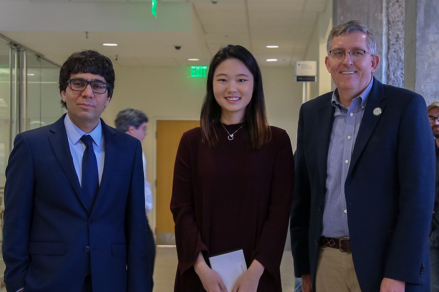 Susan Jin, center, receives her award from awards committee chair Arash Yavari, left, and School Chair Donald Webster.  (Photo: Amelia Neumeister)