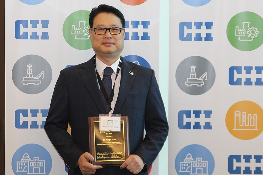 Associate Professor Yong Cho with his Distinguished Professor award from the Construction Industry Institute. (Photo Courtesy: Construction Industry Institute)